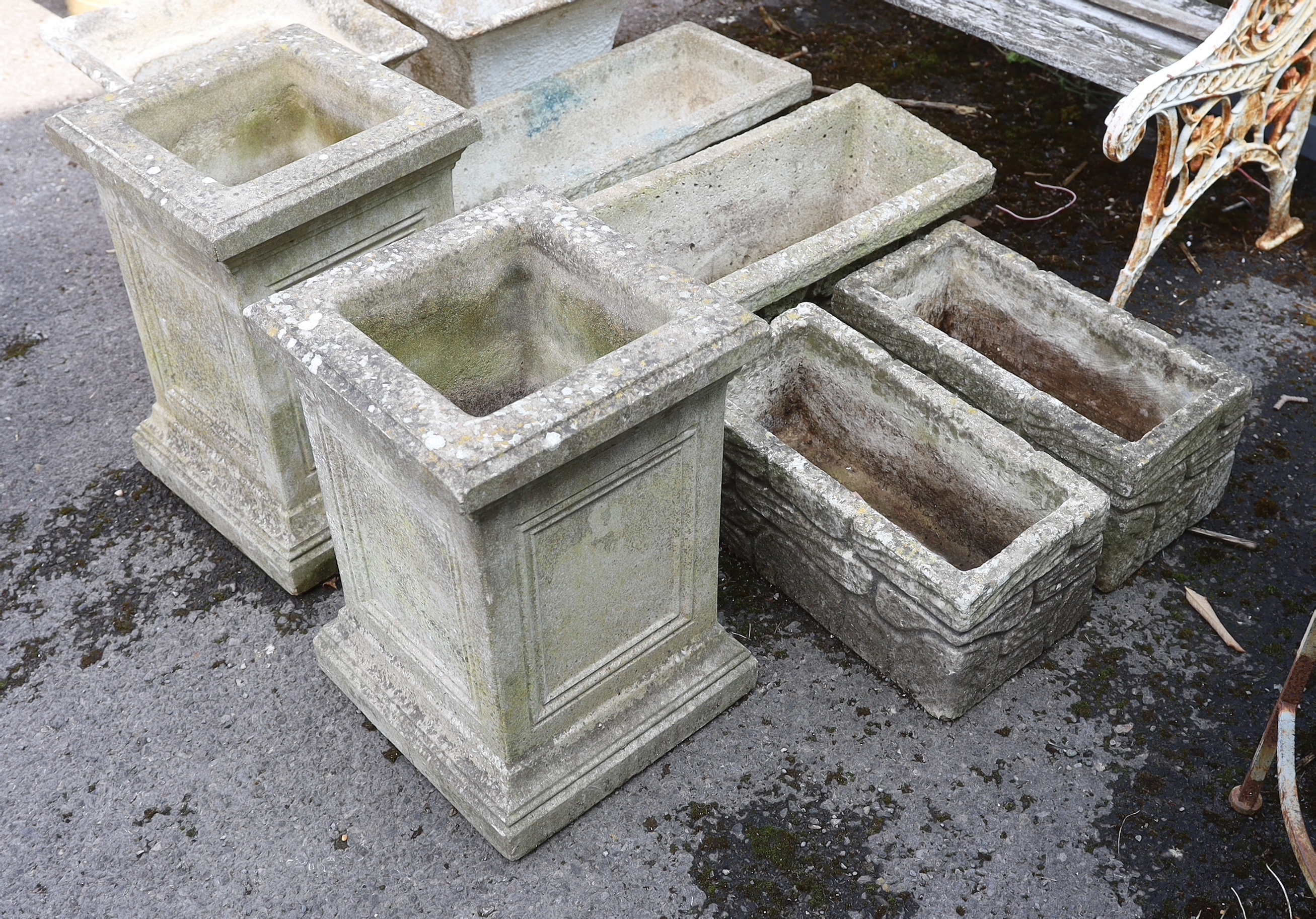 Eight assorted reconstituted stone garden planters, largest height 49cm